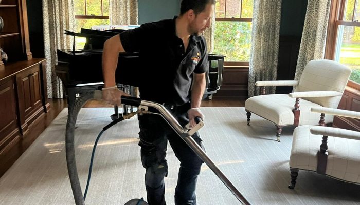 person-cleaning-carpet