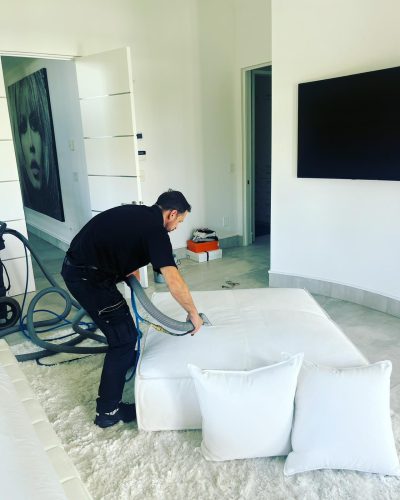 person-cleaning-mattress